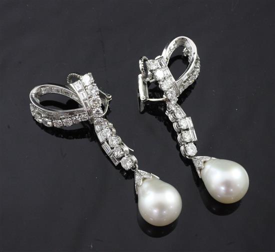 An attractive pair of late 20th century platinum, diamond and baroque pearl drop metamorphic earrings, overall 62mm.